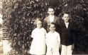  Ruth, Harold, Marlin, and Ellis Kreider in front of their grandparents' home in Campbelltown.